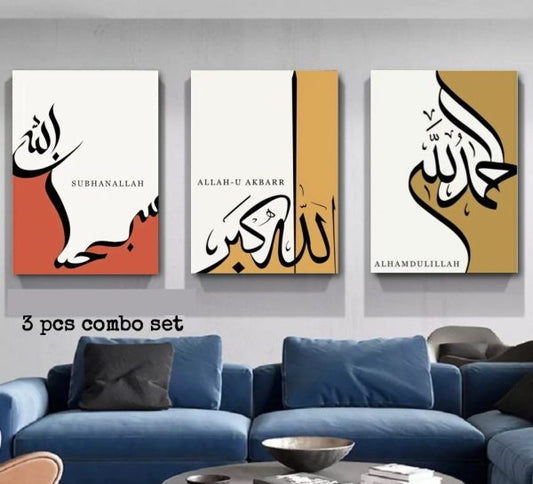 Three abstract art pieces on a wall above a blue sofa in a living room.